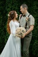 wedding walk of the bride and groom in a coniferous photo