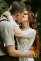 wedding walk of the bride and groom in a coniferous photo