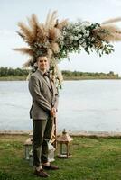 wedding ceremony of the newlyweds in a country cottage photo