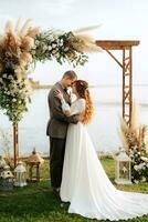 wedding ceremony of the newlyweds in a country cottage photo