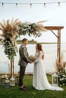 wedding ceremony of the newlyweds in a country cottage photo