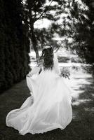 red-haired girl bride with a wedding bouquet photo