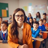 happy smiling young female teacher in glasses over the classroom photo