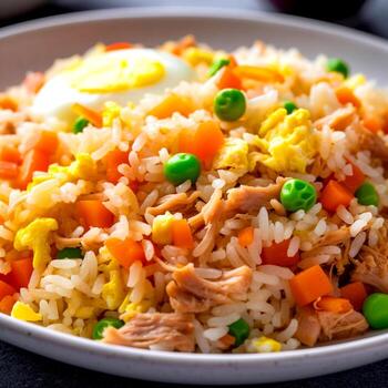 Chicken fried rice with egg on the plate photo