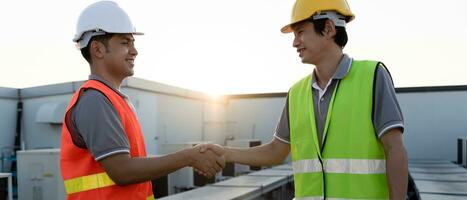 Construction worker team hands shaking greeting start up plan new project contract in office center at construction site, industry ,architecture, partner, teamwork, agreement, property, contacts. photo