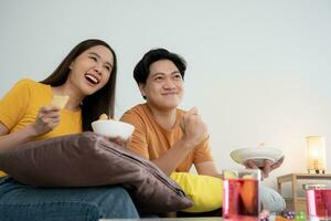 cheerful couple cheer sport, watching sporting, cheering for victory of their team. Happy energetic smiling. tv show, holiday, relax, recreation, soccer, football, series, cinema, cheer, win, fan club photo