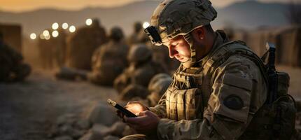 Handsome young soldier using digital tablet while sitting on dirt road AI Generated photo