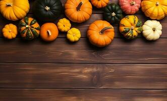 Flat lay of many colorful pumpkins and maple leaves frame on wooden background with copy space. Generative AI photo