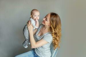 Young mother holding her newborn child photo