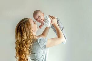 Young mother holding her newborn child photo