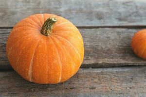 Autumnal Background. Natural autumn fall view pumpkins on wooden background. Inspirational october or september wallpaper. Change of seasons ripe organic food concept, Halloween party Thanksgiving day photo