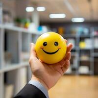 male office worker hand holding a smiling emoji ball in the office generative ai photo