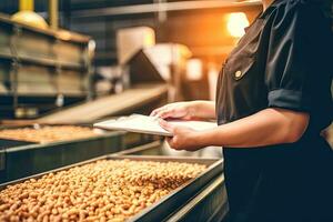 Manager woman  doing quality control standing by machines in food production workshop, Generative AI . photo