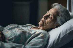 Old years woman patient sleeping on bed in hospital ward. Health care ,Generative AI. photo