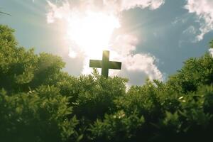 The cross of God with green Leaf, in the rays of the sun and blue sky. Cross on the hill with green trees and graeen natural view. Religious concept, AI Generative photo