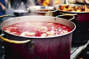 Beverages fruits and berries hot mulled wine in pots with steam in street food market. Generative AI photo