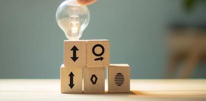 Creative idea, solution and innovation concept. Idea generation for business development. Wooden cube blocks with light bulb and cycle icons on clean background and copy space. AI Generative photo