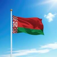 Waving flag of Belarus on flagpole with sky background. photo