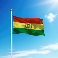 Waving flag of Bolivia on flagpole with sky background. photo