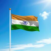 Waving flag of India on flagpole with sky background. photo