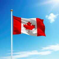 Waving flag of Canada on flagpole with sky background. photo