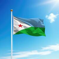 Waving flag of Djibouti on flagpole with sky background. photo