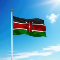 Waving flag of Kenya on flagpole with sky background. photo