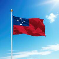 Waving flag of Samoa on flagpole with sky background. photo