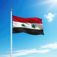 Waving flag of Syria on flagpole with sky background. photo