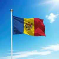 Waving flag of Moldova on flagpole with sky background. photo
