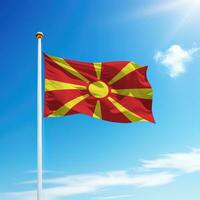 Waving flag of North Macedonia on flagpole with sky background. photo