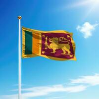 Waving flag of Sri Lanka on flagpole with sky background. photo