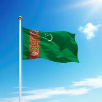 Waving flag of Turkmenistan on flagpole with sky background. photo