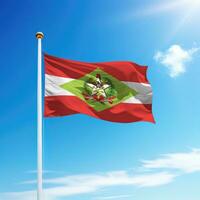 Waving flag of Santa Catarina is a state of Brazil on flagpole photo