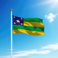 Waving flag of Sergipe is a state of Brazil on flagpole photo