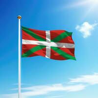 Waving flag of Basque Country is a community of Spain on flagpole photo