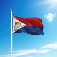 Waving flag of Sint Maarten on flagpole photo