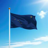 Waving flag of Alaska is a state of United States on flagpole photo