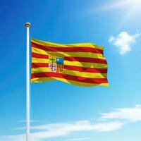 Waving flag of Aragon is a community of Spain on flagpole photo