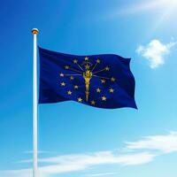 Waving flag of Indiana is a state of United States on flagpole photo