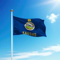 Waving flag of Kansas is a state of United States on flagpole photo