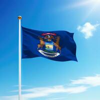 Waving flag of Michigan is a state of United States on flagpole photo