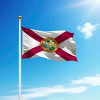 Waving flag of Florida is a state of United States on flagpole photo