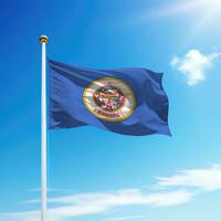 Waving flag of Minnesota is a state of United States on flagpole photo