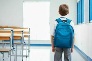 Back view of a schoolboy with a backpack standing in the classroom.  AI Generative Pro Photo