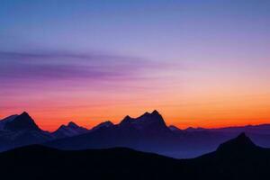 mountain silhouettes at sunset. AI Generative Pro Photo