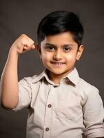 Happy Indian kid in casual clothing against a neutral background AI Generative photo