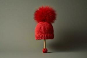 A woolen cap with a pom-pom on top photo