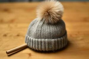 A woolen cap with a pom-pom on top photo