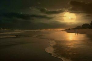 The soft glow of a full moon over the beach photo